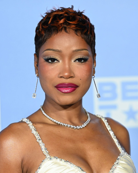 Keke Palmer poses in a white beaded gown